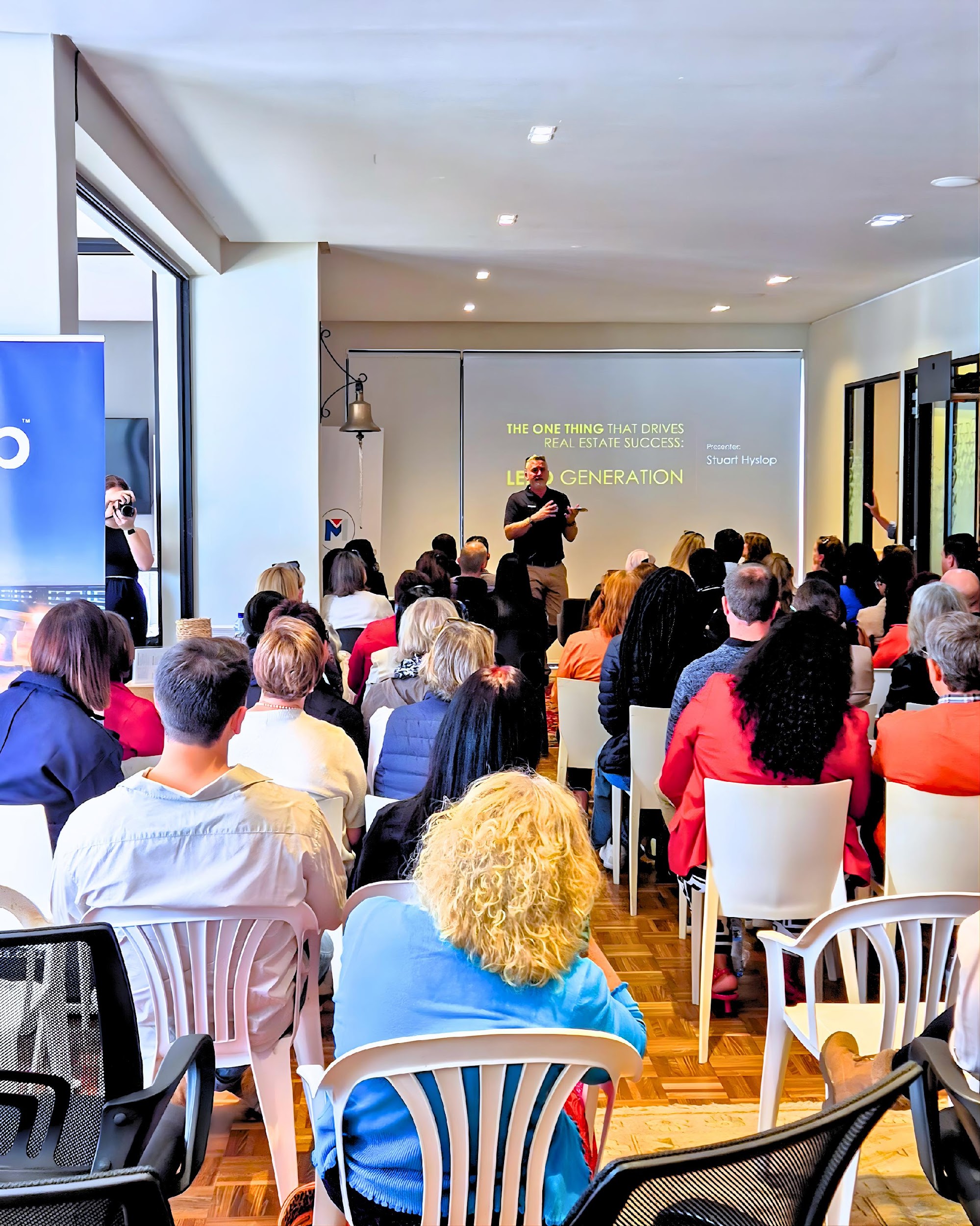 Property professionals listening to a presentation at an agent learning event
